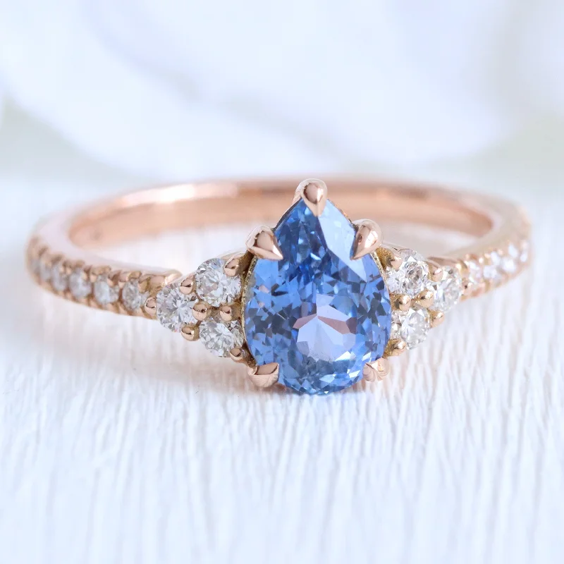 Halo engagement rings with sparkling diamonds surrounding a center stone for a luxurious look -1.78 Ct Pear Ceylon Blue Sapphire Ring in 14k Rose Gold 3 Stone Diamond Ring, Size 6.5