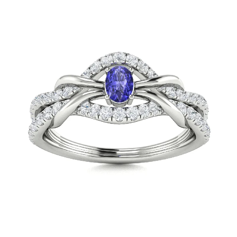 Engagement rings with three-stone settings symbolizing past, present, and future love -14kt Gold Oval Brilliant Tanzanite and Diamond Ring (Tanzanite 0.25 cts. Diamonds 0.25 cts.)