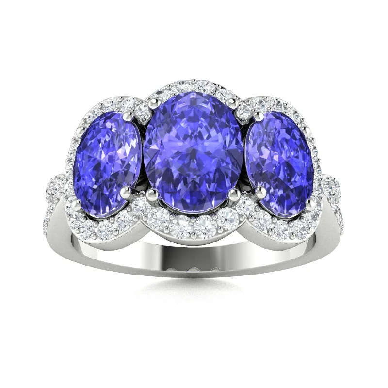 Classic three-stone engagement rings with diamonds symbolizing love’s journey together -14KT Gold Oval Brilliant Tanzanite and Diamond Ring (Tanzanite 2.80 cts. White Diamond 0.40 cts.)