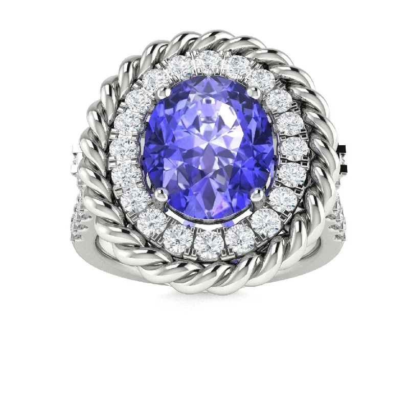 Engagement rings with hidden diamonds for a surprise sparkle on the band -14KT Gold Oval Tanzanite and Diamond Ring (Tanzanite 2.50 cts. White Diamond 0.60 cts.)