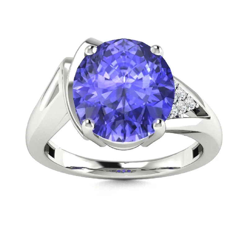 Elegant solitaire engagement rings with sleek bands for understated beauty and grace -14KT Gold Oval Tanzanite and Diamond Ring (Tanzanite 3.25 cts. White Diamond 0.05 cts.)