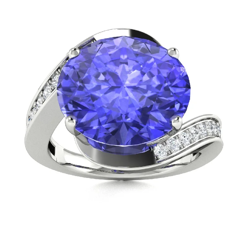 Modern engagement rings with tension settings for a sleek, floating look -14KT Gold Oval Tanzanite and Diamond Ring (Tanzanite 3.25 cts. White Diamond 0.33 cts.)