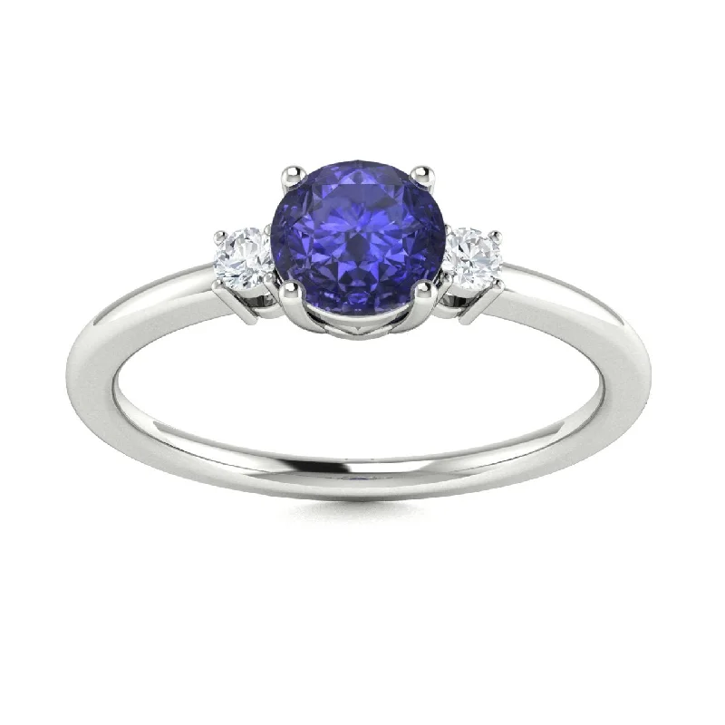 Three-stone engagement rings with diamonds and colored gemstones for a vibrant, meaningful look -14Kt Gold Round Brilliant Tanzanite and Diamond Ring (Tanzanite 0.75 cts. White Diamonds 0.20 cts.)