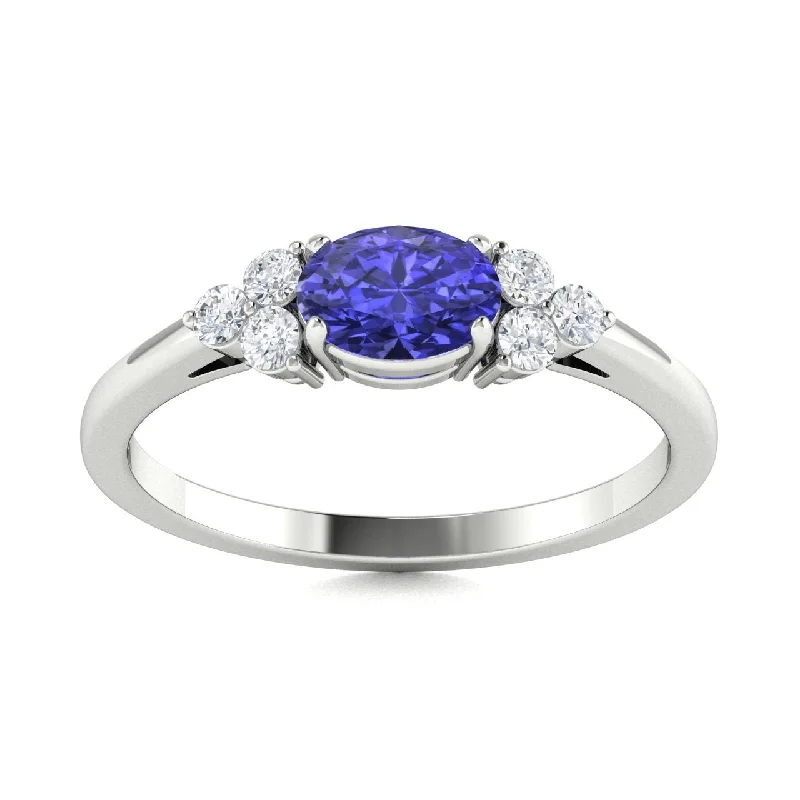 Engagement rings with diamond sidestones for added brilliance and a modern touch -14kt Gold Tanzanite and Diamond Ring (Tanzanite 0.75ct Diamonds 0.10 cts)