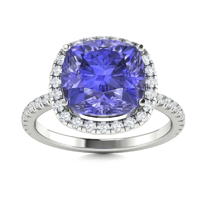 Engagement rings with aquamarine center stones for a cool, calming blue hue -18kt Gold Cushion Cut Tanzanite and Diamond Ring (Tanzanite 2.00ct Diamonds 0.20 cts)