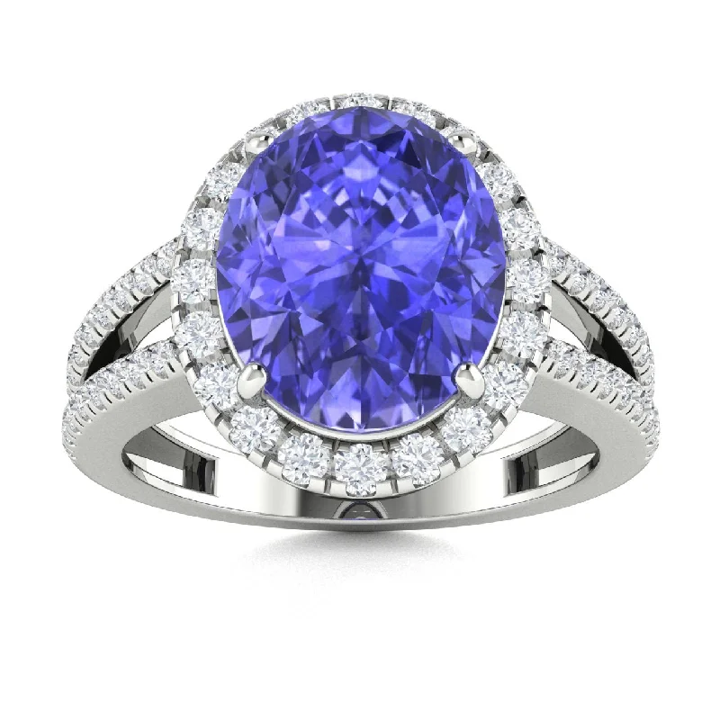 Unique engagement rings with rough-cut diamonds for a rustic, natural look -18kt Gold Tanzanite and Diamond Ring (Tanzanite 4.25ct Diamonds 0.50cts)