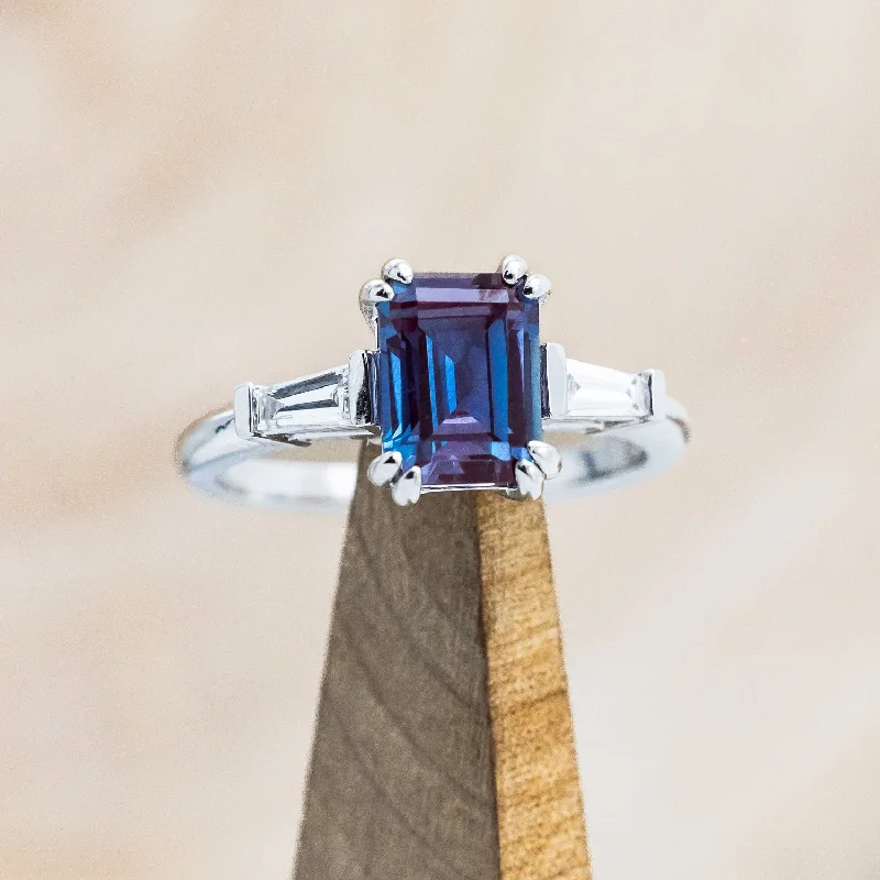 Engagement rings with innovative designs featuring tension or floating diamond settings -"ALBINA" - EMERALD CUT LAB-GROWN ALEXANDRITE ENGAGEMENT RING WITH LAB-GROWN DIAMOND ACCENTS