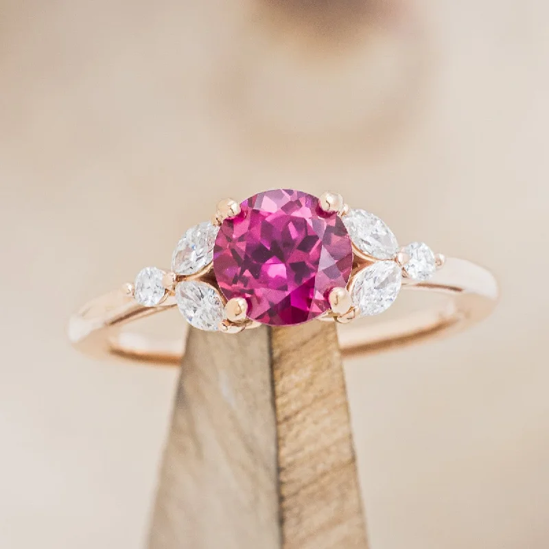 Engagement rings with three-stone settings symbolizing past, present, and future love -"BLOSSOM" - ROUND CUT LAB-GROWN RUBY ENGAGEMENT RING WITH LEAFCUT DIAMOND ACCENTS