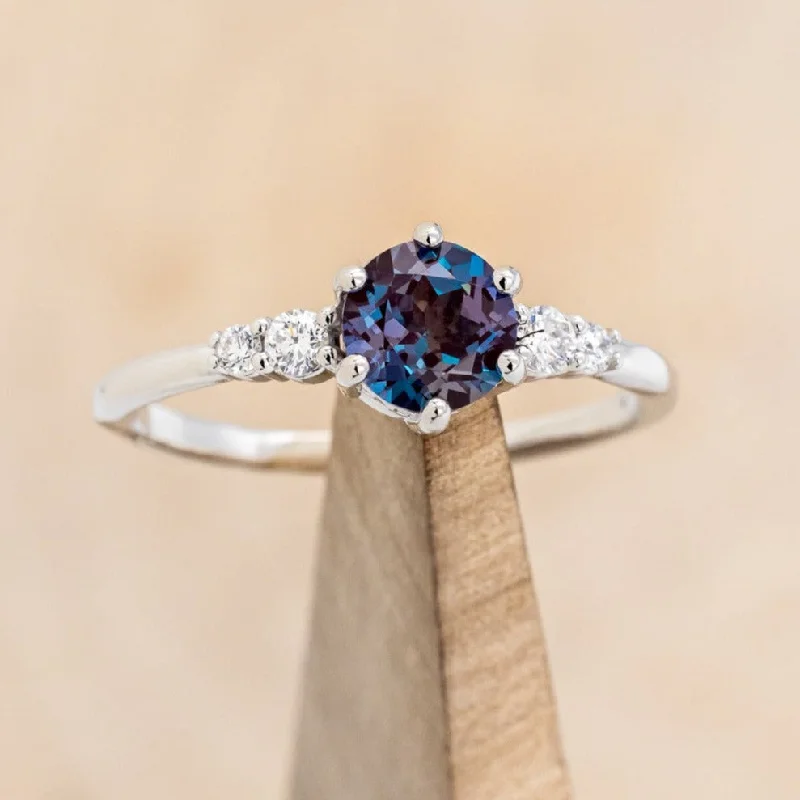 Custom engagement rings with personalized designs and engraved messages for uniqueness -"GEMINI" - ROUND CUT LAB-GROWN ALEXANDRITE ENGAGEMENT RING WITH DIAMOND ACCENTS