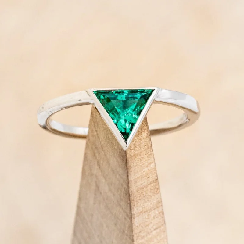 Engagement rings with three-stone settings symbolizing past, present, and future love -"JENNY FROM THE BLOCK" - TRIANGLE CUT LAB-GROWN EMERALD ENGAGEMENT RING