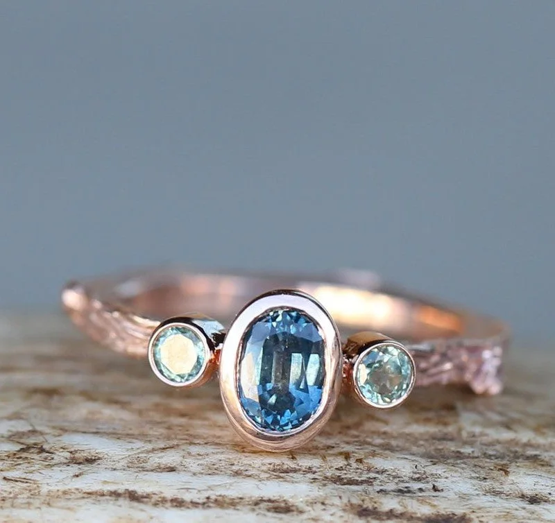 Classic engagement rings with baguette side stones for vintage charm and sophistication -OVAL LONDON BLUE TOPAZ ENGAGEMENT RING WITH SAPPHIRE ACCENTS