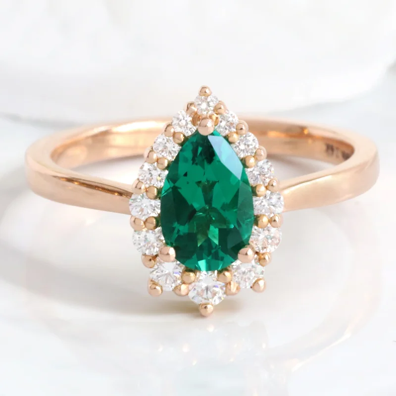 Yellow gold engagement rings for women who love classic, vintage-inspired designs -Pear Emerald Engagement Ring in Tiara Halo Diamond Tapered Band