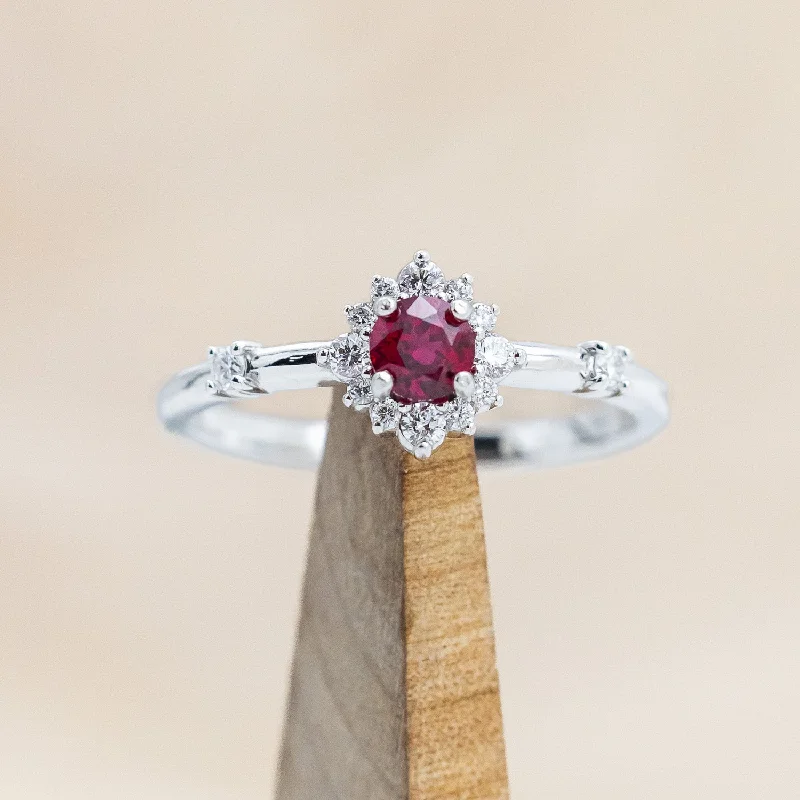 Custom engagement rings with mixed metal designs for a modern and trendy look -"STARLA" - ROUND CUT LAB-GROWN RUBY ENGAGEMENT RING WITH STARBURST DIAMOND HALO