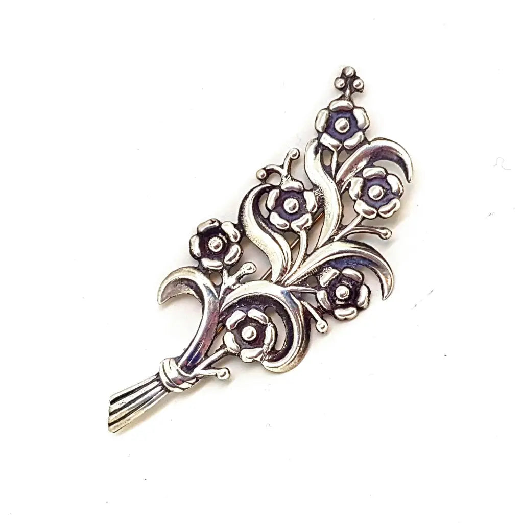 Brushed brooches and pins with rough stone texture -Flower brooch in sterling silver. Circa 1940. Antique and vintage jewelry.