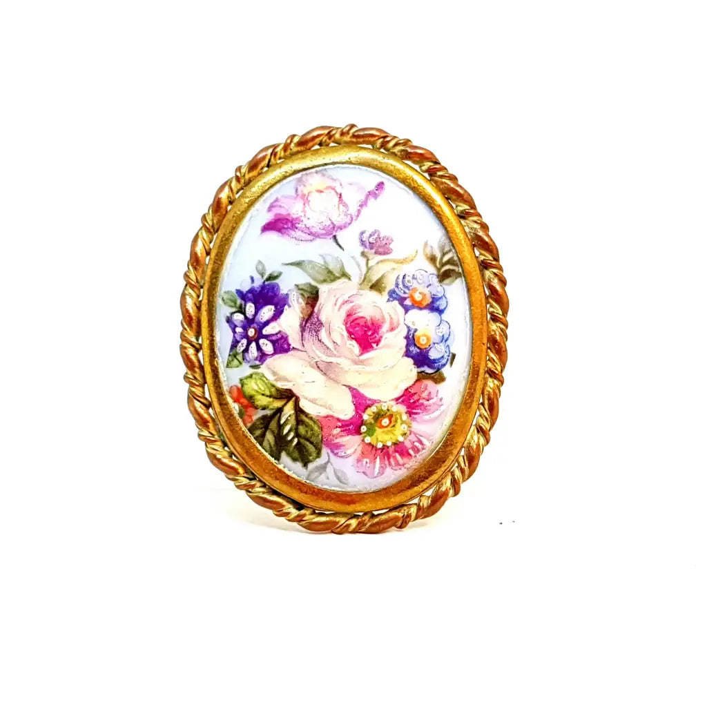 Brooches and pins featuring sapphire for blue shine -Limoges porcelain brooch. France. Flower scene. Around 1940.